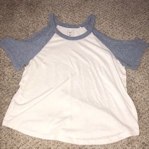 White shoulder cut off shirt